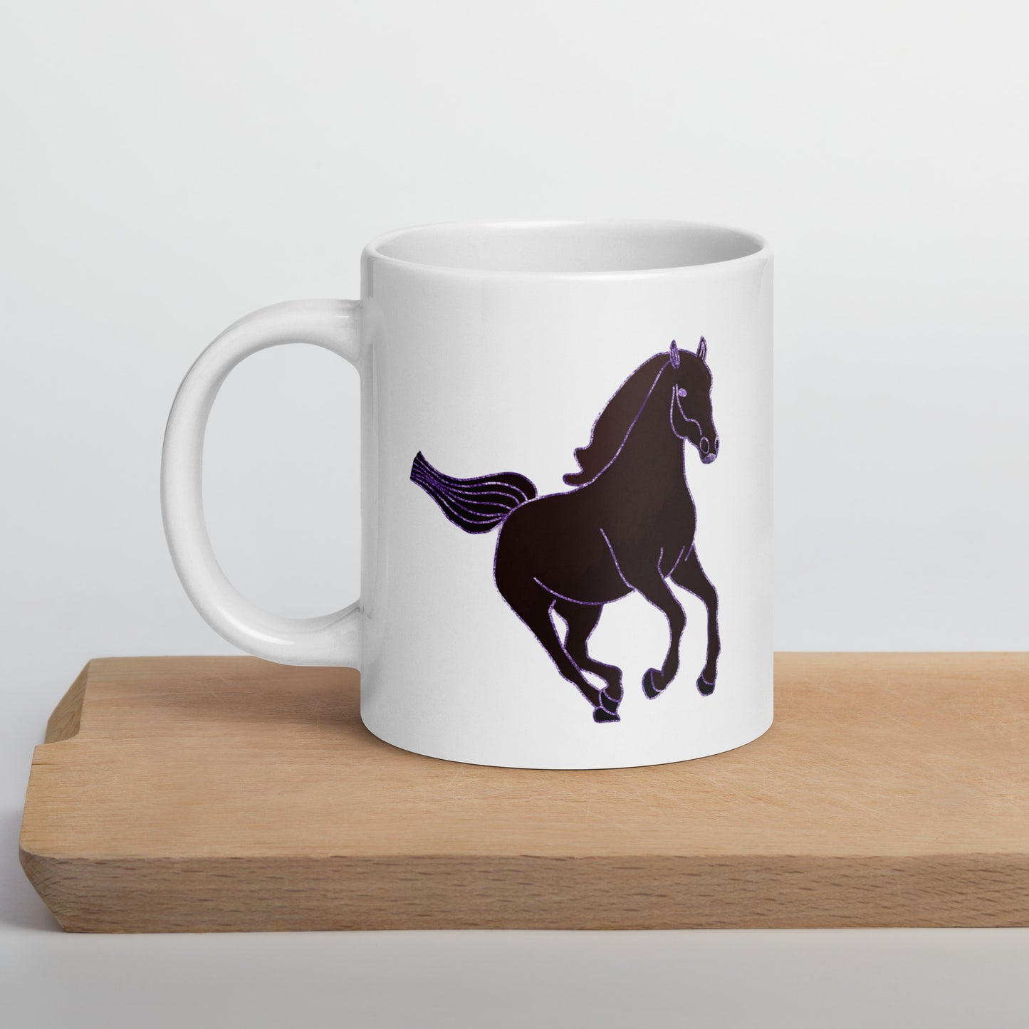 White ceramic Horse Coffee Mug with a black horse design on a wooden surface