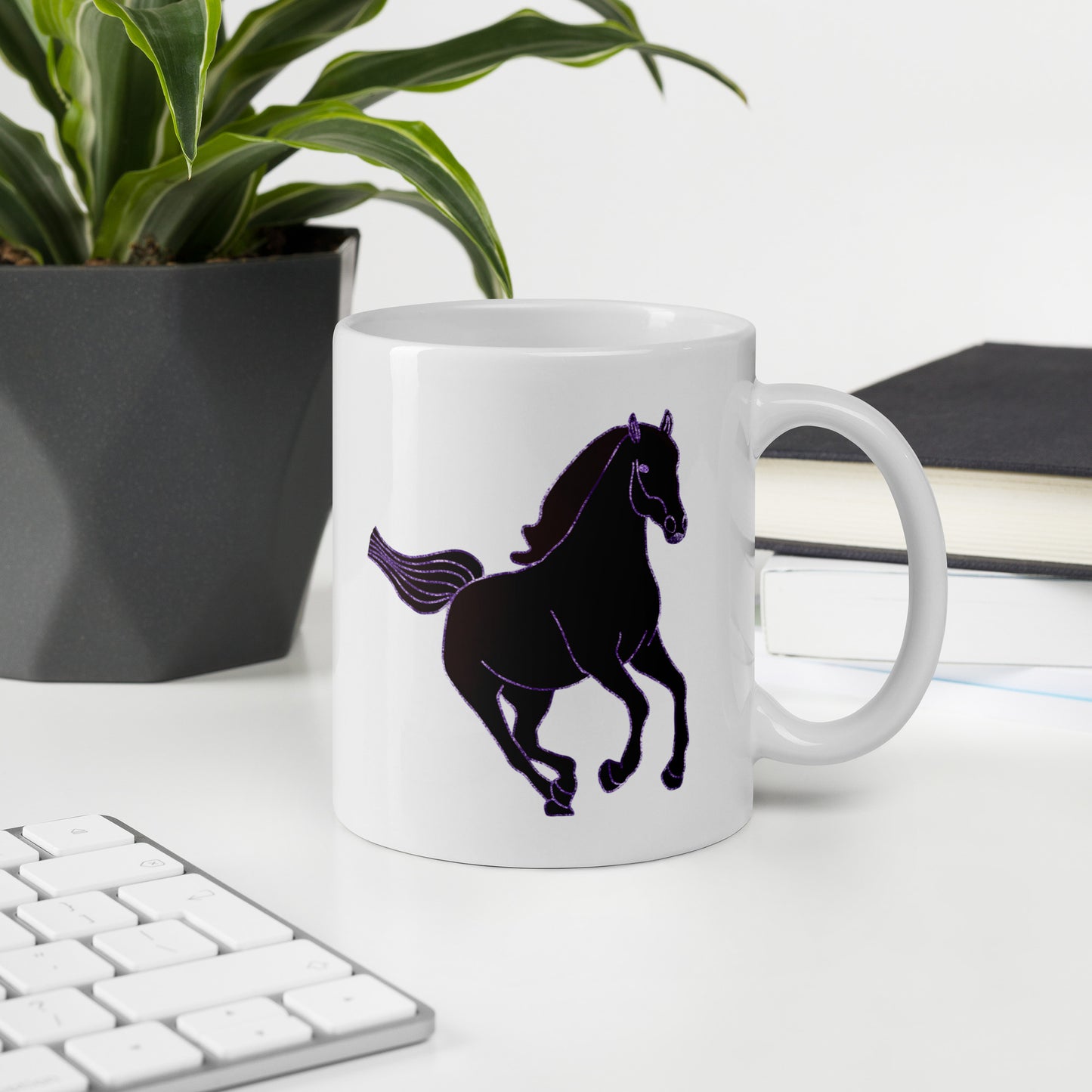 White Horse Coffee Mug with black horse silhouette on desk near keyboard and plant
