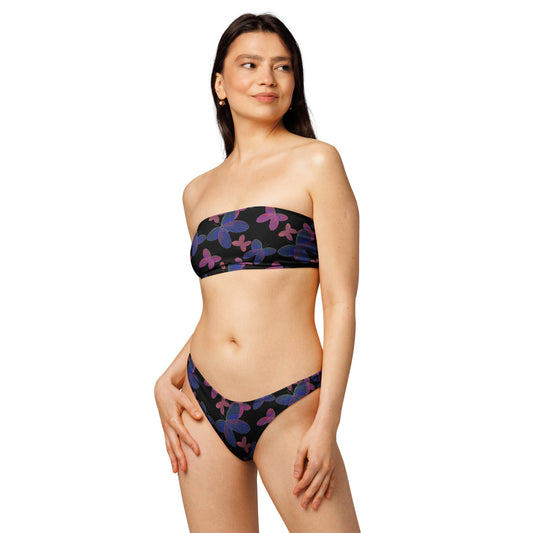 front view of model wearing butterfly bandeau bikini on black