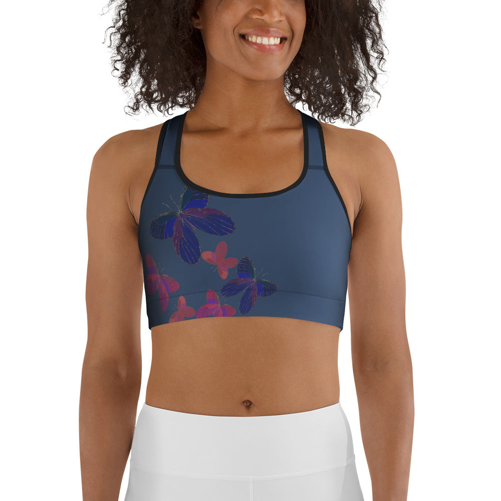 front view of model wearing blue grey butterfly sports bra