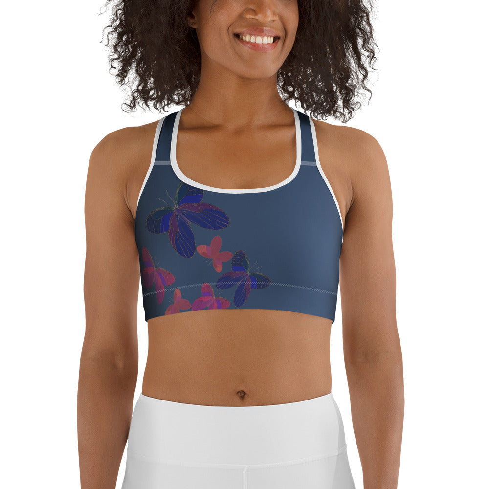 front view of model wearing blue grey butterfly sports bra