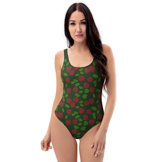 front view of model wearing cherry one piece swimsuit in forest green