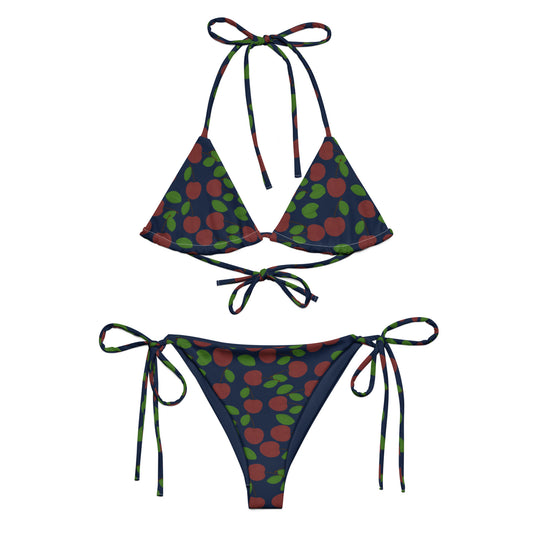 front view of model wearing cherry string triangle bikini in navy