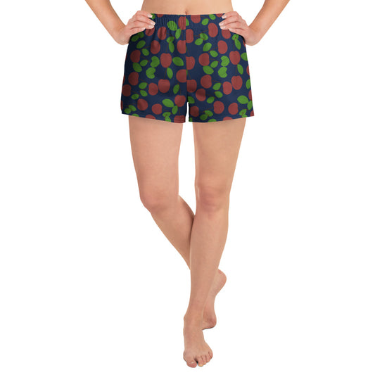front view of model wearing cherry swim shorts in navy
