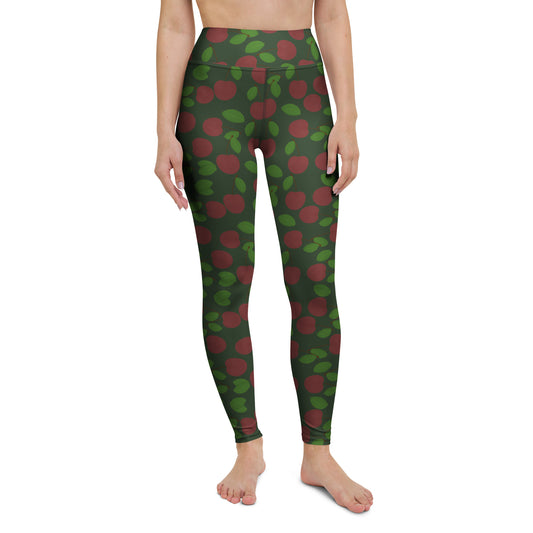 front view of model wearing cherry yoga leggings in green