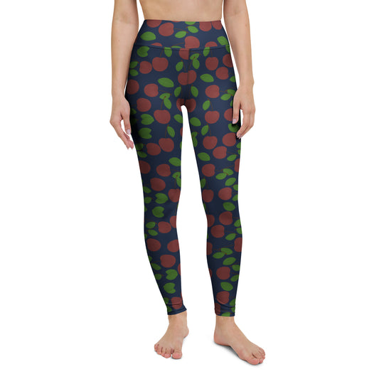 front view of model wearing cherry yoga leggings in navy