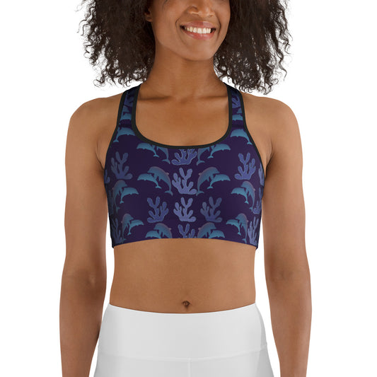  front view of model wearing coral reef dolphins sports bra in purple