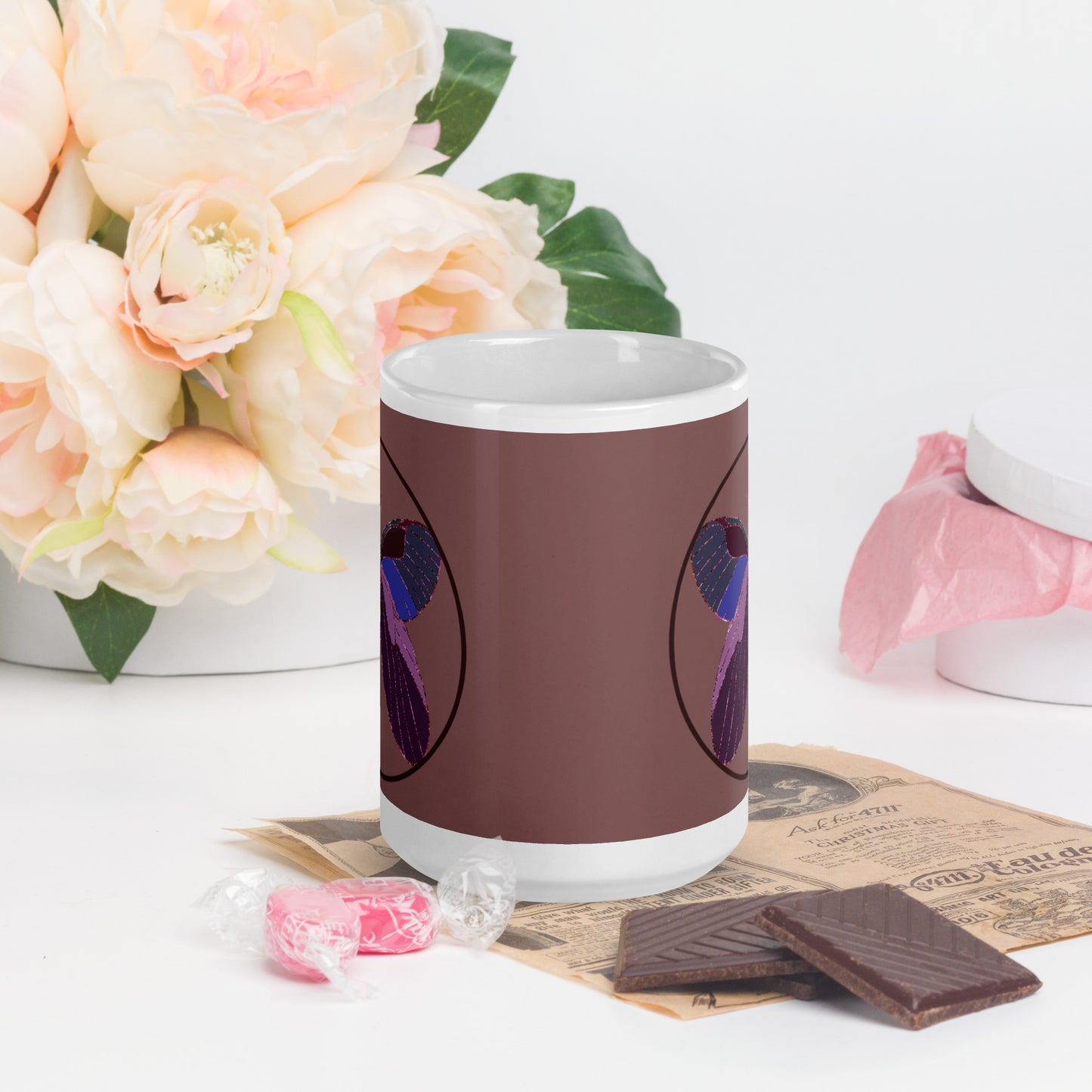 White ceramic mug with an enchanted butterfly with a dark ring on dark background 