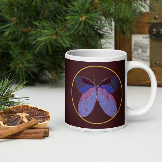 White ceramic mug with an enchanted butterfly with a gold ring on dark background. Perfect gift for earth day, housewarmings, birthdays, Valentines, Thanksgiving, Christmas, Father’s Day and Mother’s Day.
