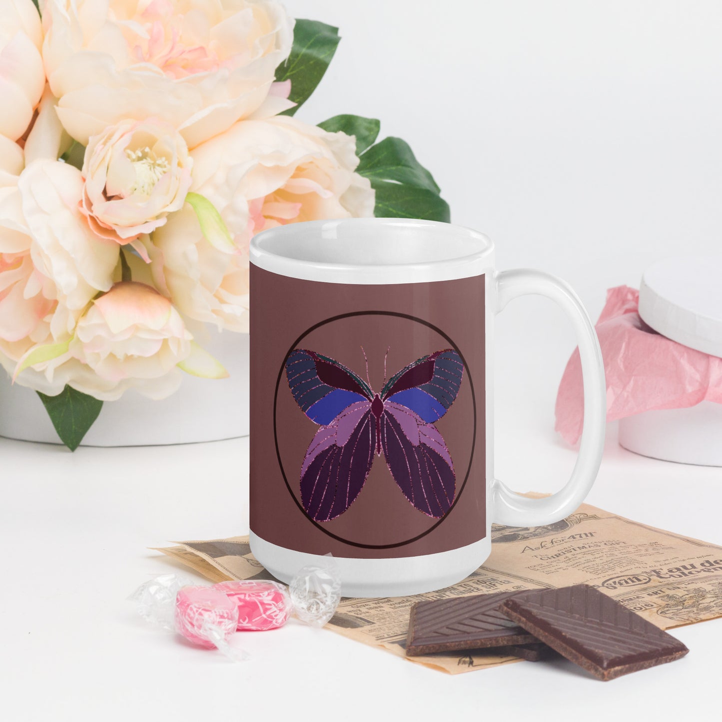 White ceramic mug with an enchanted butterfly with a dark ring on dark background 
